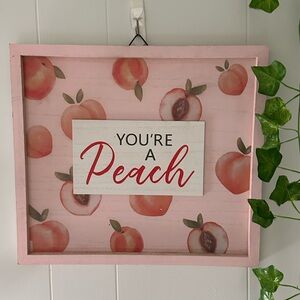 Peach-Themed Wall Decor with Pink Frame